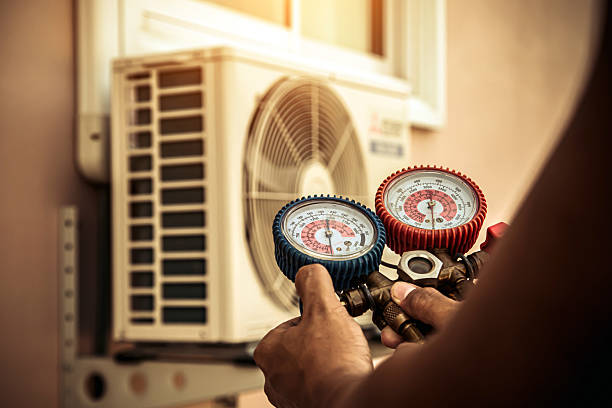 Professional Air Conditioning Service technician working in Newport, NY
